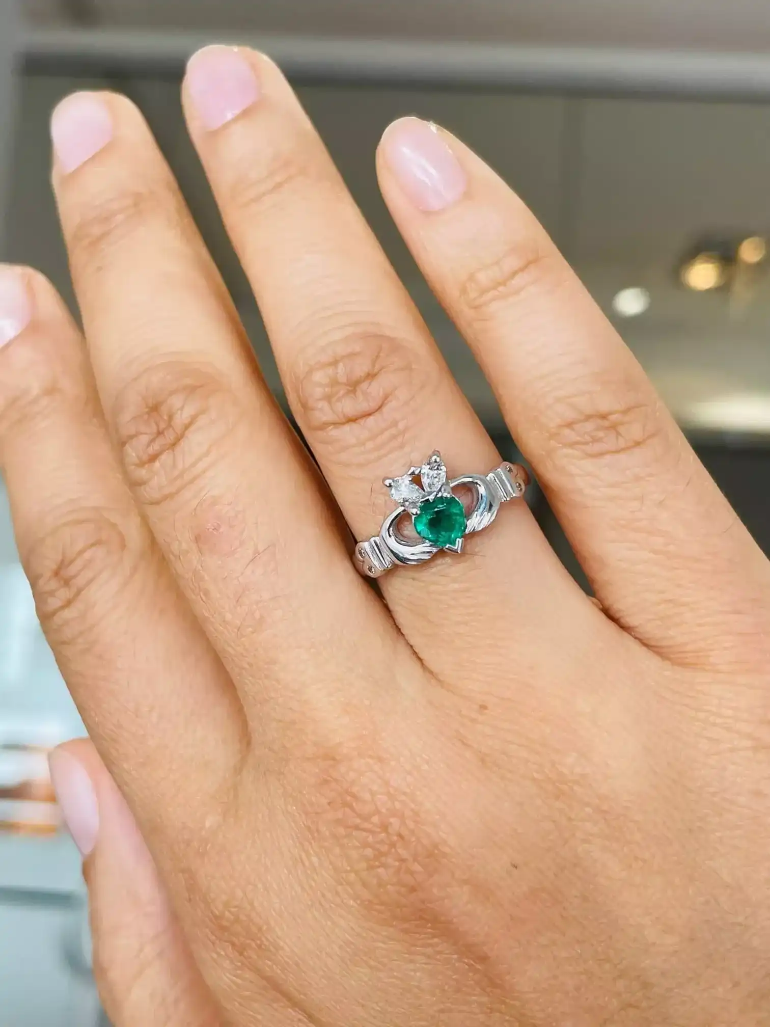 Heartshape Emerald And Diamond Claddagh Ring in White Gold