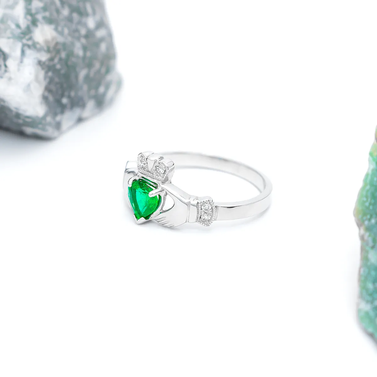 Elegantly Designed Claddagh Ring Featuring A Glistening Heart-shaped Emerald 